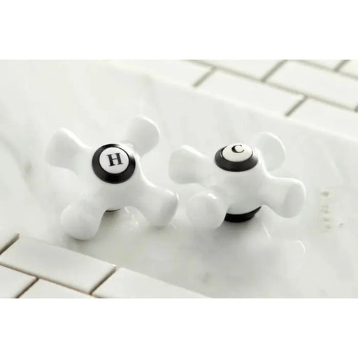 Kingston Brass Vintage KS3120PX Two-Handle 3-Hole Wall Bathroom Faucet Matte Black Hot and Cold Porcelain Cross Handler